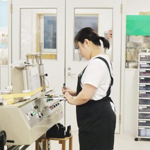 Staff manually inspecting barcode labels